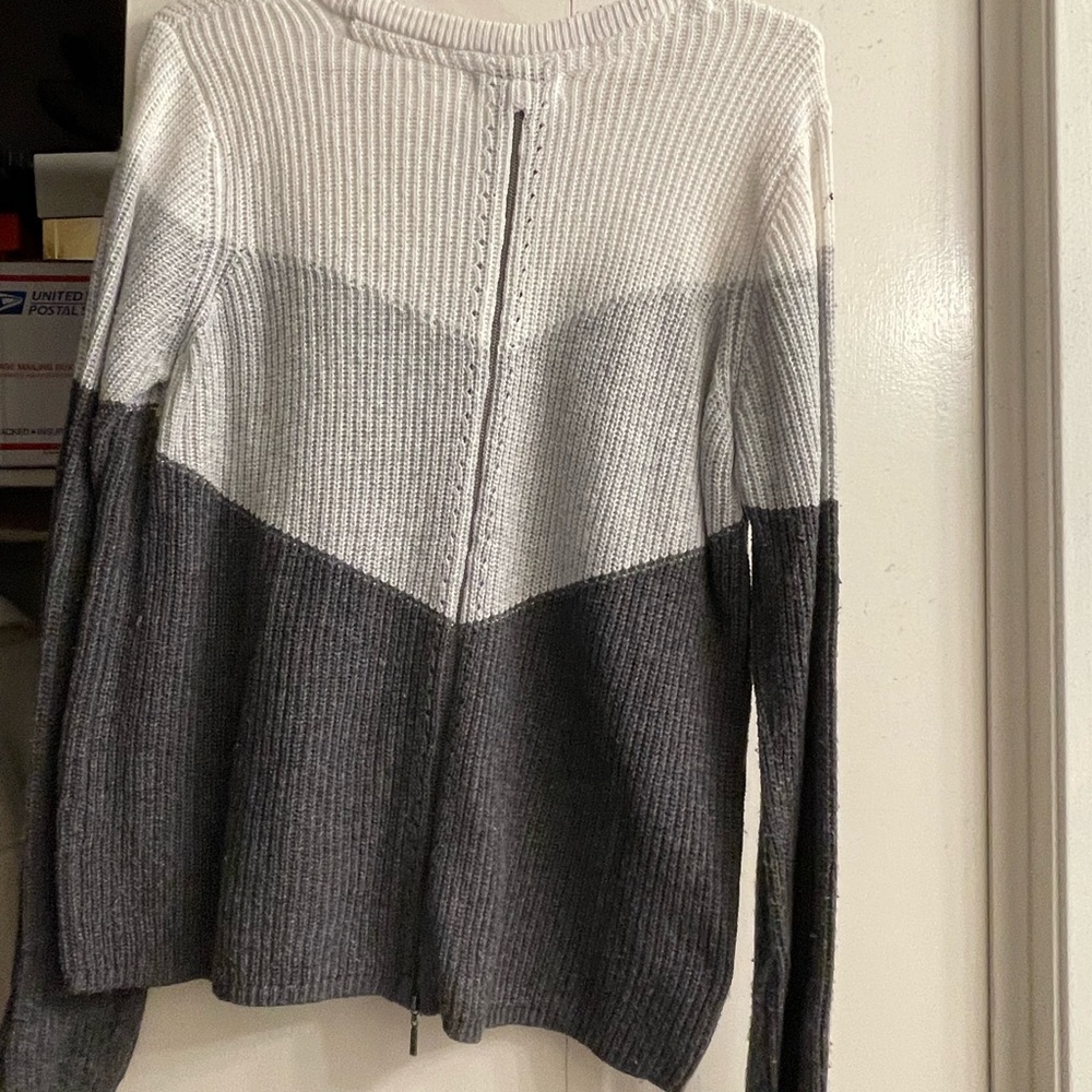 Super cute grey and white sweater with cute zipper detail in the back.